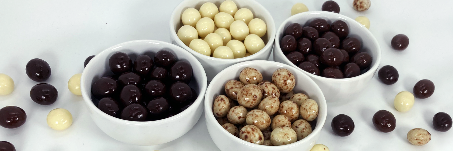 Dilettante Chocolates Chocolate-Covered Espresso Beans featuring milk, white, dark, and marbled chocolate flavors