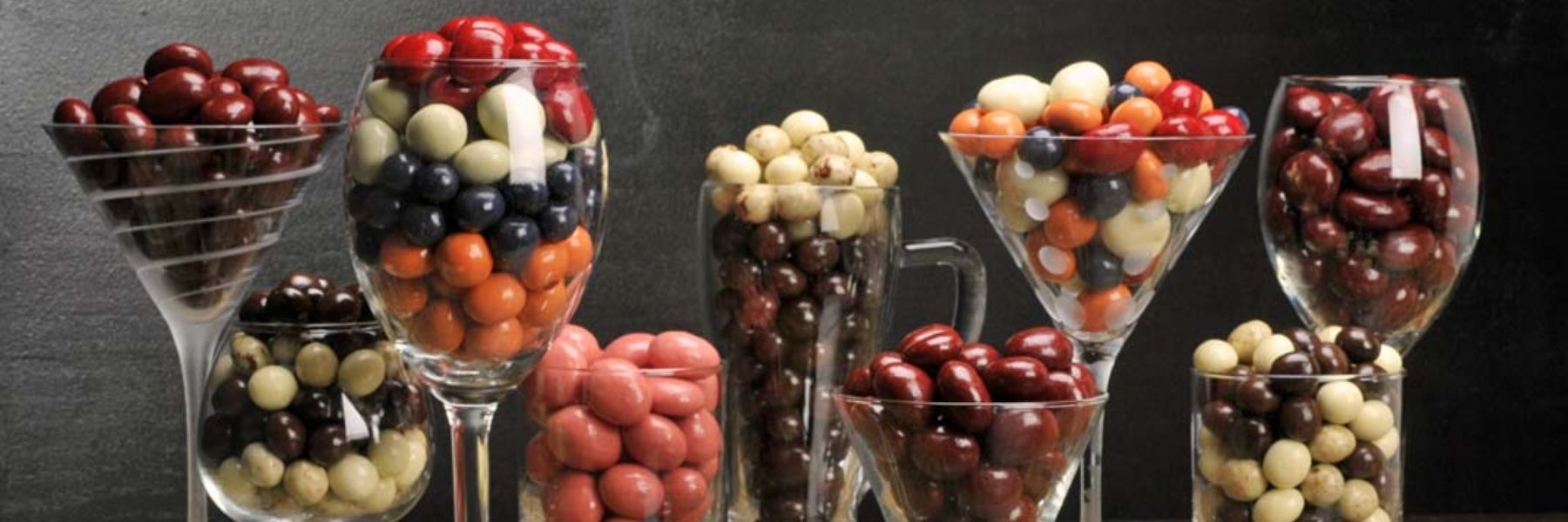 Dilettante Chocolates Chocolate-Covered Fruit in Fancy Glasses on Display