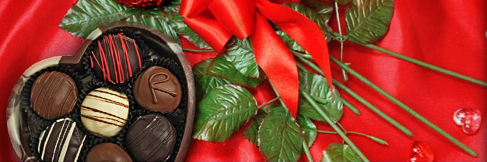 Dilettante Chocolates Valentines Day Blog Banner with a Heart-Shaped Box with Flowers