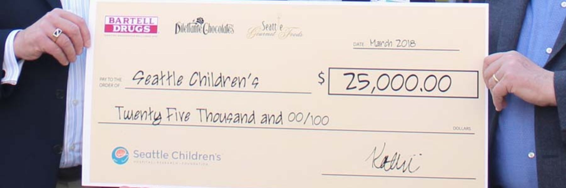 Dilettante Chocolates 25,000 check for Seattle Children's Hospital