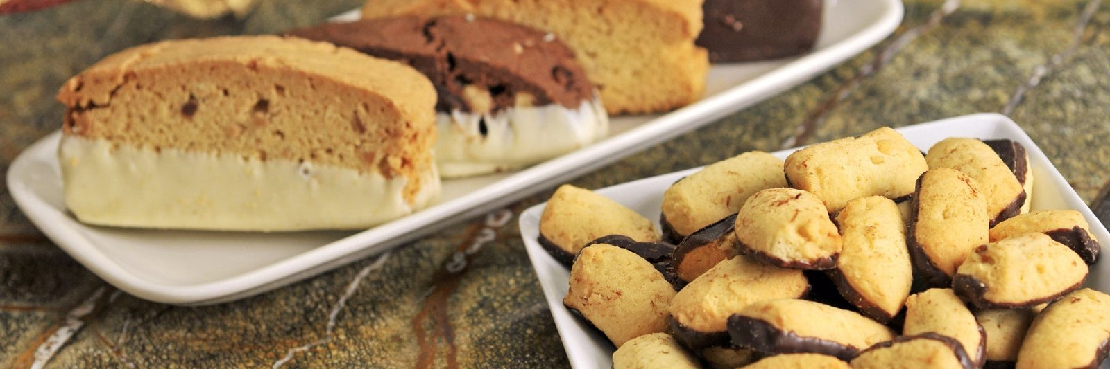 Dilettante Chocolates Cookie Gems and Butter Biscotti on Ornate Plates