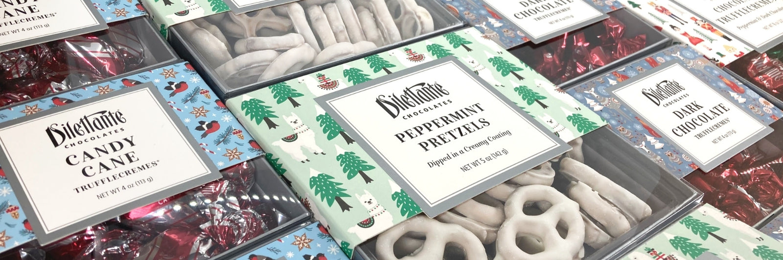 New Holiday Gift Boxes from Dilettante Chocolates featuring Peppermint Pretzels, new TruffleCreme assortments and milk chocolate holiday foils