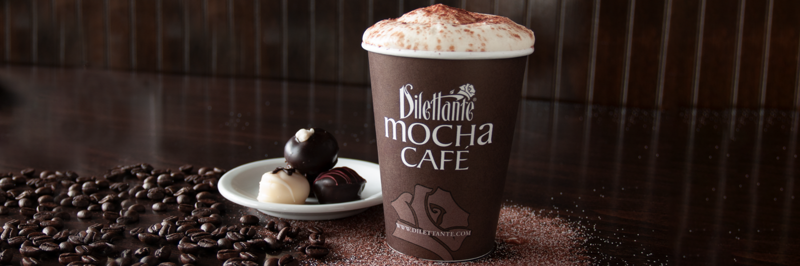 Dilettante Mocha beside a small plate of truffles