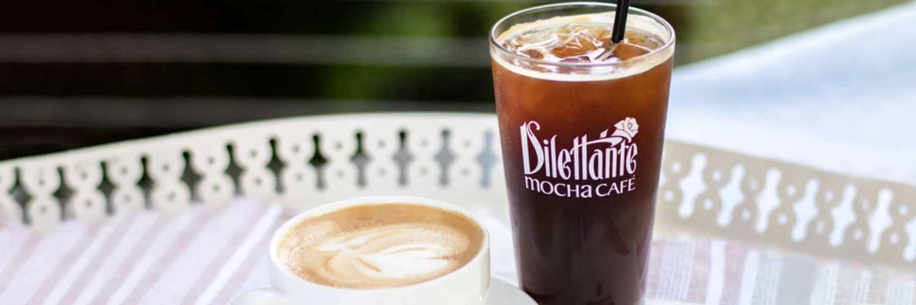 Dilettante Chocolates Cold Brewed Coffee beside a latte