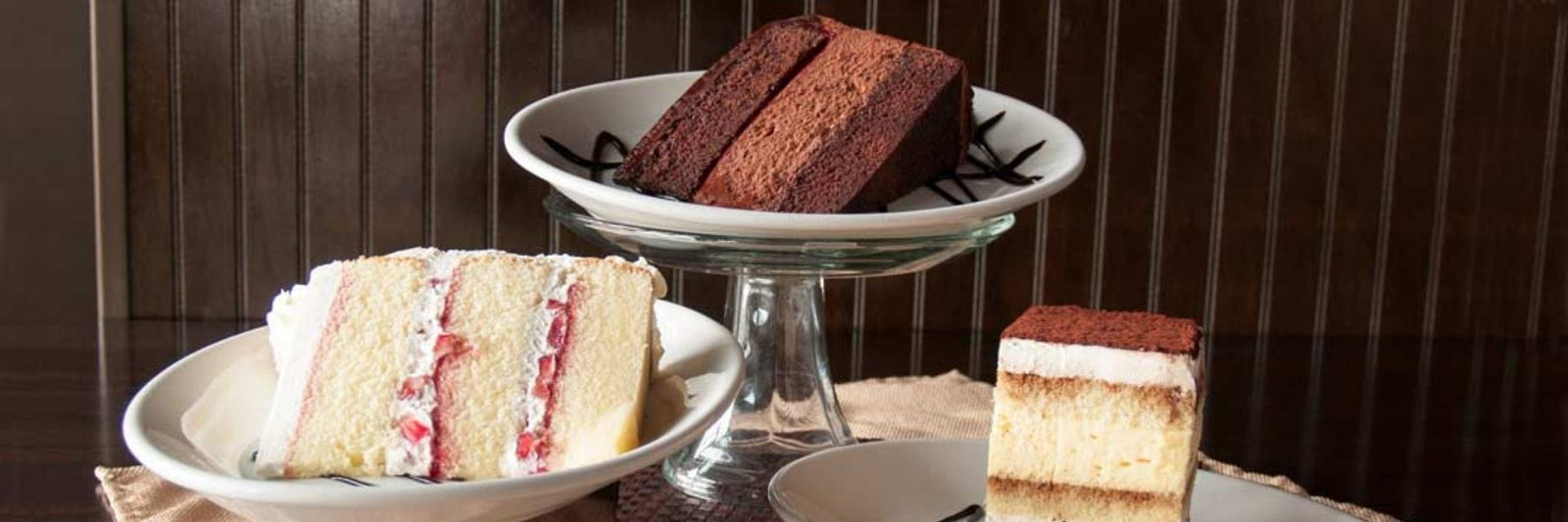 Dilettante Cakes Displayed on Several Display Plates