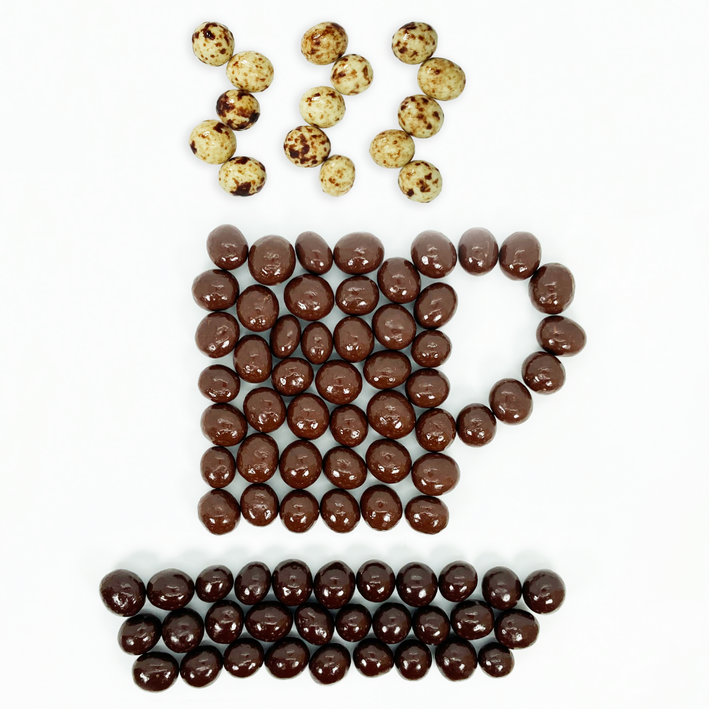 Dilettante Chocolates Espresso beans coated in milk, white, and dark chocolate in the shape of a coffee cup