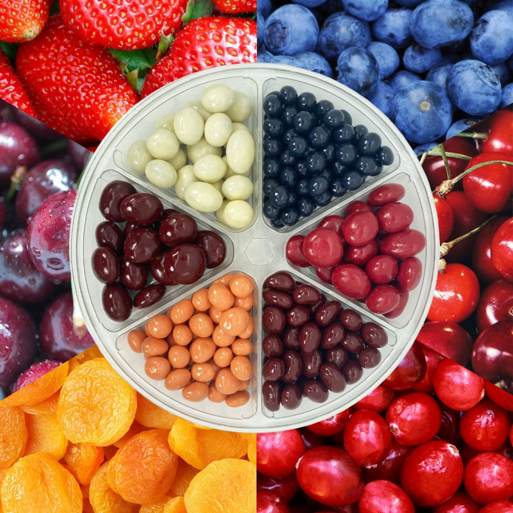 Dilettante Chocolates Chocolate-Covered Fruit Medley Wheel beside associated fruit flavors. Experience delicious tastes from chocolate-covered cherries, apricots, cranberries, strawberries, and blueberries.